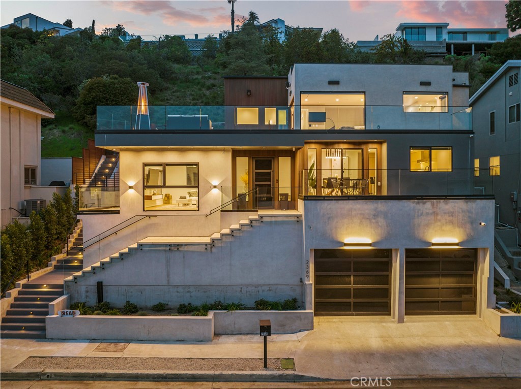Fully renovated in 2023, experience contemporary living at its finest in this modern home nestled in the highly sought-after Mount Olympus neighborhood. Enjoy open air living, highlighted by walls of glass that bathe the interior with warm natural light and perfectly frame the twinkling city light views. The main living area boasts an open concept design, consisting of a spacious living room, formal dining room and modern chef’s kitchen equipped with Thermador appliances and a massive waterfall island. Numerous patios and balconies extend the living space, allowing you to indulge in indoor/outdoor living from any room. Outside, take a dip in the refreshing pool/spa or enjoy a delicious al fresco meal prepared in the outdoor kitchen. Retreat inside to one of four generously sized bedrooms, including a luxe primary suite that boasts an expansive balcony, custom walk-in closet and spa-like bathroom appointed with a soaking tub, rainfall shower system and double vanity. Additional amenities include high ceilings, a dedicated laundry room and two car garage. Offered fully furnished.