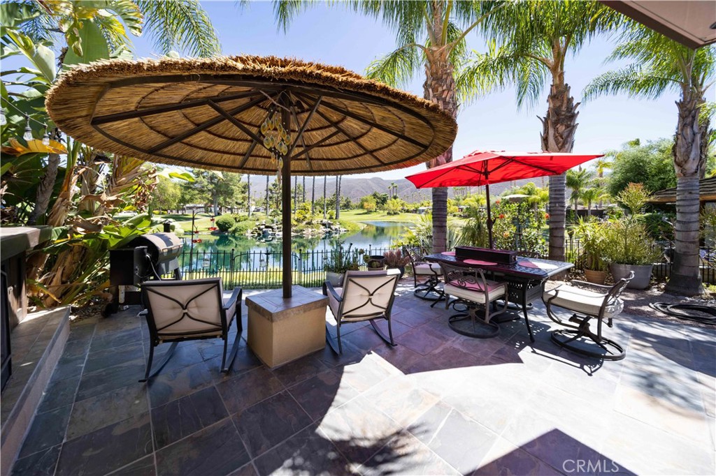 A Truly One-of-a-Kind Opportunity! Welcome to an extraordinary RV lot at the prestigious Rancho California RV Resort, where luxury living meets nature’s beauty. The moment you step onto your impeccably crafted slate driveway, you’ll be captivated by the elegance and serenity of this lot, designed to be the ultimate retreat. Take in the panoramic views of a scenic waterfall and lush golf course, paired with stunning sunrises that promise to brighten your mornings. After a day of adventure, unwind in your private sanctuary under the shade of a Palapa—a perfect setting to enjoy the outdoors. And just steps away, a charming fireplace awaits, creating a cozy ambiance for cool evenings under the stars. Your lot features a fully screened-in Allumawood brick combination build-out, designed to offer both style and comfort. Inside, you’ll find a welcoming dining space, a spacious island kitchen with ample cabinet storage, and a washer and dryer for your convenience. The living room is thoughtfully arranged for relaxation, with large windows that invite the natural beauty of the outdoors inside. An electric roll-up sunshade allows you to control the sunlight, making this space enjoyable year-round. The added convenience of a septic-free ½ bath water closet ensures comfort while maintaining the integrity of the lot’s design and functionality.This is one of the most beautifully developed lots in all of Rancho California RV Resort, offering an unparalleled living experience. With luxurious amenities, stunning views, and a relaxing outdoor space, this lot is truly a once-in-a-lifetime opportunity to embrace the RV lifestyle at its finest. 38' Pinnacle bath and half also 4sale. Financing Available....