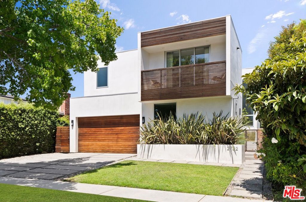 Built in 2015, this striking architectural residence blends modern design with warm, livable spaces in the heart of West LA. Spanning 2,831 sq. ft. on a 5,718 sq. ft. lot, the home features 4 bedrooms and 5 baths, offering an ideal floor plan for both daily living and entertaining. Soaring ceilings, expansive windows, and an open-concept layout fill the interiors with natural light, while high-end finishes and thoughtful details create a sense of understated luxury. The gourmet kitchen with premium appliances flows seamlessly into the dining and living areas, opening to a private outdoor space perfect for al fresco dining and relaxation. Each of the three bedrooms and the lower level suite are generously sized, with the serene primary suite boasting a spa-like bath and walk-in closet. Located on a quiet, tree-lined street just moments from shops, dining, and vibrant neighborhood amenities, this contemporary gem delivers the best of Los Angeles living.