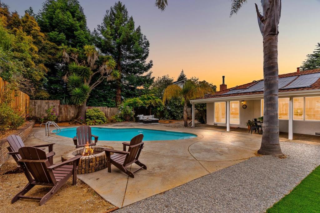 Beautiful, serene, single-level home in the highly desirable Country Club Park neighborhood of Rio del Mar. Set on a spacious lot with a half-circle driveway and inviting curb appeal, this 4 bedroom, 2.5 bath home offers comfort, convenience, and California-style living at its best. Inside, you'll find an ideal open concept layout with generous living spaces, a modern kitchen with a butler's pantry and wine storage, and seamless indoor-outdoor flow. The backyard is a true retreat, featuring privacy, brand new turf, mature landscaping, an inviting pool, and multiple spaces designed for relaxing, dining, and entertaining. Located minutes from beaches, golf, dining, and top-rated schools, this home offers the best of Aptos living in one of its most established neighborhoods.