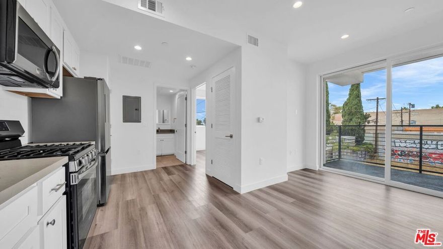 Light & bright 1bed 1bath modern apartment with in-unit washer & dryer, central AC and a beautiful new kitchen with stainless steel appliances.  The unit also has wood laminate floors throughout and a large private balcony. Other features include a fitness room, private and controlled access throughout the building and one assigned parking spot in the secure gated garage. Enjoy the two rooftop decks and rooftop community garden with its remarkable views. PET FRIENDLY.
