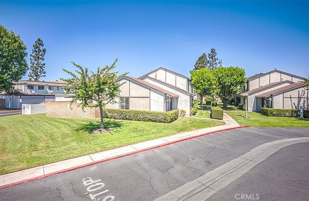 Highly sought-after and seldom available, single-story home! This spacious 3-bedroom, 2-bathroom corner unit is the largest single-story layout in the community, featuring one of the most expansive backyards. It's "Move-in-ready" with fresh paint and tile flooring throughout. This attached single-family townhome is nestled in the scenic Brookdale Community. Enjoy the convenience of a 2-car garage with laundry hookups that provide direct access to both the yard and the home. The property is just a short distance from the complex's amenities, which include a pool, clubhouse, and children's playground. The community offers ample parking, and the HOA permits 3rd and 4th vehicles to be parked outside with a permit. Ideally located near the 22 and 405 freeways.