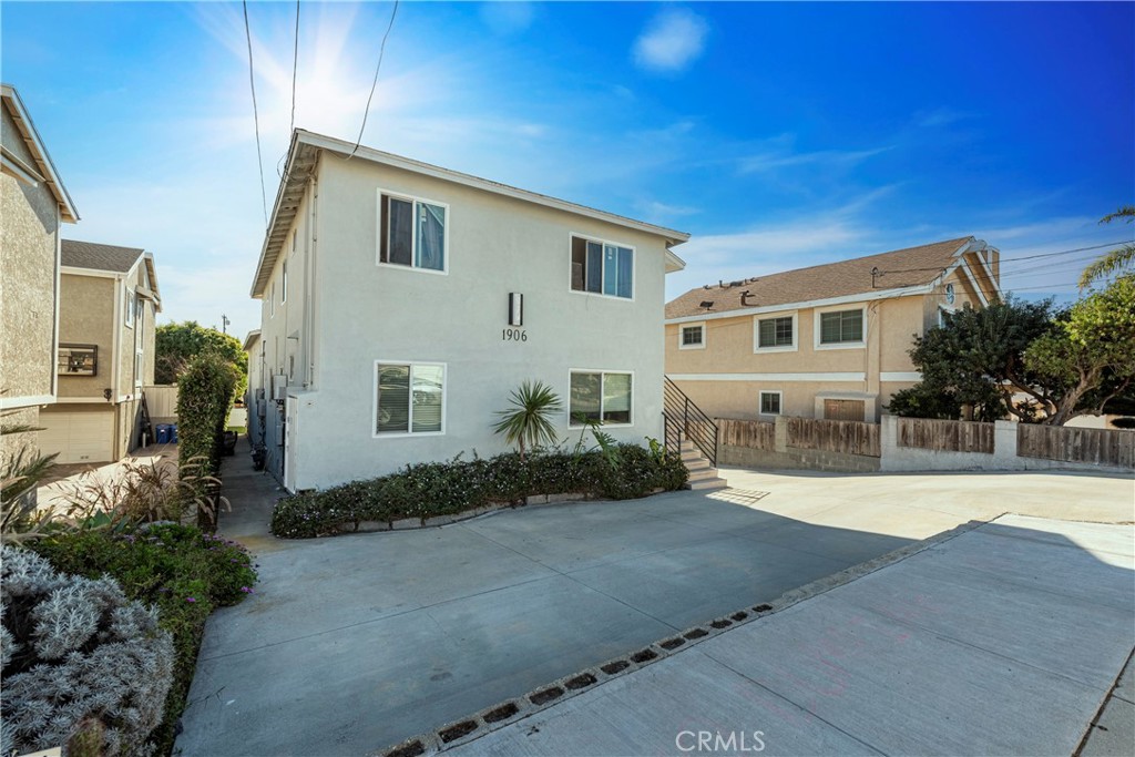 Great Location - First floor end unit with neighborhood views - Beautifully remodeled 2 Bedroom + 1 Bathroom apartment with 2 parking spaces. New paint, new floors throughout, new kitchen cabinets, new engineered-stone countertops and stainless-steel appliances. Includes stove/oven, dishwasher, microwave and refrigerator. Kitchen opens to large Living Room and has Laundry area inside, with bright natural light. Ceiling fans throughout the home. There are 2 nice size Bedrooms with a convenient hallway Bathroom. This is an 6 unit building with plenty of sunlight. This unit comes with 2 parking spaces; 1 garage space and 1 designated driveway parking space for this unit.