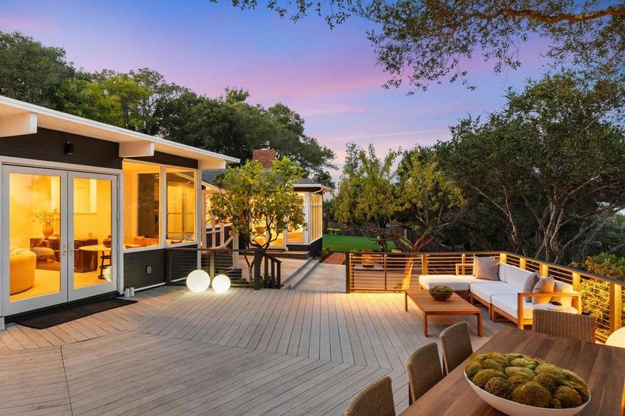 Modern California luxury with timeless architectural pedigree this home captures sweeping Bay views from every room of this private, gated Hillsborough retreat. Designed by renowned architect Angus McSweeney, the home showcases open, light-filled spaces anchored by a grand foyer, a striking great room with two fireplaces, and walls of glass framing the horizon. The chef's kitchen features a luminous agate island, Wolf range and a seamless connection to the dining and living areas, perfect for everyday living and effortless entertaining. The primary suite offers floor-to-ceiling windows, fitted closets, and a stone spa bath. Set on nearly an acre of landscaped grounds, this estate includes a new turf lawn, expansive deck, pool, BBQ area, and modern glass-door garage. Ideally located just minutes from Burlingame Avenues vibrant shops and dining, top-rated Hillsborough schools, and convenient access to SFO and Silicon Valley, this residence epitomizes Peninsula living at its most refined.