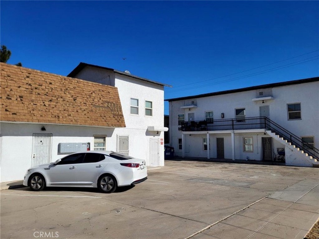Now available in the heart of Barstow, this charming 1-bedroom, 1-bathroom unit offers 650 square feet of functional living space in a well-maintained, multi-unit community. The interior features durable tile flooring throughout, a spacious living area filled with natural light, and a kitchen with ample cabinetry, granite counters, and a large window above the sink. The bedroom offers generous proportions and a ceiling fan, while the full bathroom includes a shower-tub combo with vintage tile accents. Enjoy the comfort of a wall A/C unit and the convenience of assigned parking just outside your door.