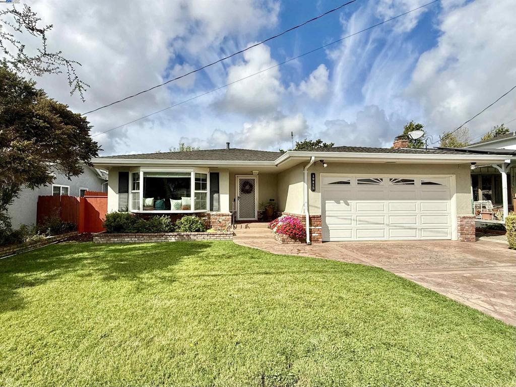 Welcome to this delightful 3-bedroom, 2-bathroom home offering 1,468 sq. ft. of comfortable living space. Ideally situated on a peaceful court, the property is conveniently close to Castro Valley High School and local amenities. Step inside to find a spacious living room filled with natural light from a large bay window. The central kitchen features rich wood cabinetry, stone countertops, and is well-appointed for preparing gourmet meals. Adjacent to the kitchen is a generous family room with a cozy brick fireplace and ample natural light, creating the perfect gathering space. A dining area with a convenient pass-through to the kitchen offers easy access to the side yard. All three bedrooms are nicely sized, including the primary suite with its own private bathroom. The back bedroom offers access to the beautifully maintained backyard, complete with a quaint deck—ideal for relaxing or entertaining. Additional highlights include newer laminate flooring throughout much of the home, dual-pane windows, central air conditioning, and solar power for energy efficiency. This charming home combines comfort, convenience, and character in a prime Castro Valley location.