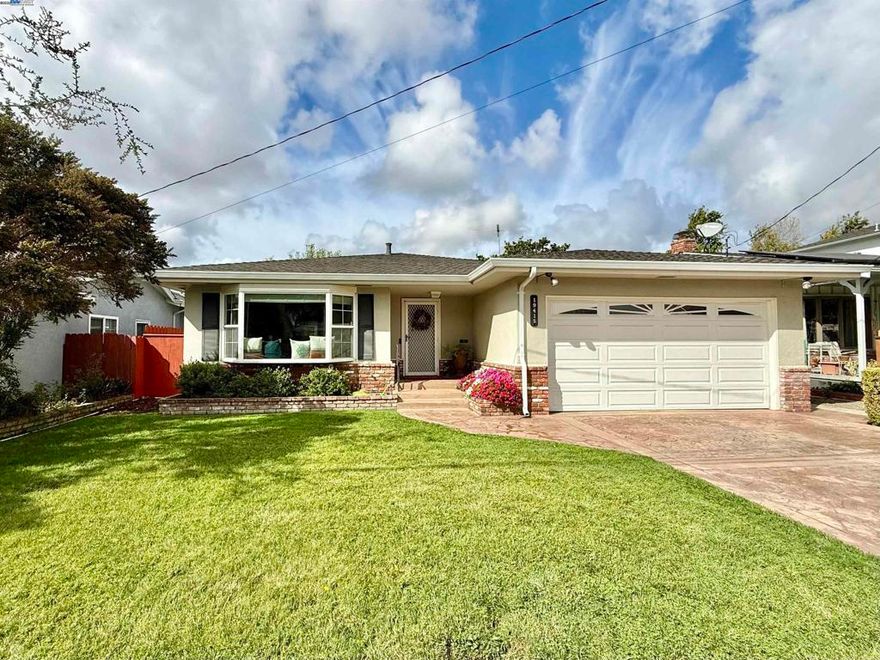 Welcome to this delightful 3-bedroom, 2-bathroom home offering 1,468 sq. ft. of comfortable living space. Ideally situated on a peaceful court, the property is conveniently close to Castro Valley High School and local amenities. Step inside to find a spacious living room filled with natural light from a large bay window. The central kitchen features rich wood cabinetry, stone countertops, and is well-appointed for preparing gourmet meals. Adjacent to the kitchen is a generous family room with a cozy brick fireplace and ample natural light, creating the perfect gathering space. A dining area with a convenient pass-through to the kitchen offers easy access to the side yard. All three bedrooms are nicely sized, including the primary suite with its own private bathroom. The back bedroom offers access to the beautifully maintained backyard, complete with a quaint deck—ideal for relaxing or entertaining. Additional highlights include newer laminate flooring throughout much of the home, dual-pane windows, central air conditioning, and solar power for energy efficiency. This charming home combines comfort, convenience, and character in a prime Castro Valley location.