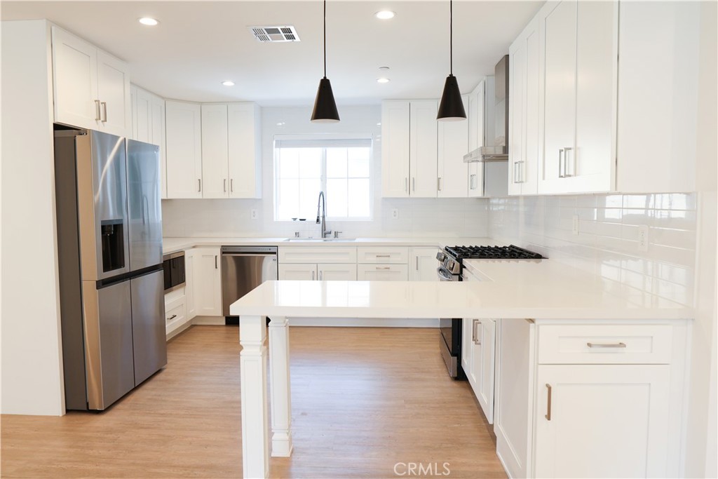 Welcome to this stunning new-construction Mediterranean home in the heart of Sherman Oaks. Built in 2023, the spacious open-concept main level offers a formal dining room with a charming balcony, a bright and inviting living room, a convenient half bath, and a chef’s kitchen featuring stainless steel appliances and a breakfast bar. Upstairs, you’ll find three generously sized bedrooms, two full bathrooms, and a dedicated laundry area with brand new LG washer and dryer. The luxurious primary suite is a true retreat, showcasing a spa-inspired bathroom with a double vanity and rainfall shower. The backyard is designed for entertaining, featuring a low-maintenance artificial turf yard and a fully equipped outdoor kitchen. Additional highlights include a main-level bedroom with its own ensuite bath and walk-in closet, a two-car garage, and a gated shared driveway. Ideally located just moments from Ventura Boulevard’s dining, shopping, and top-rated schools, this home offers the perfect blend of style, comfort, and convenience.