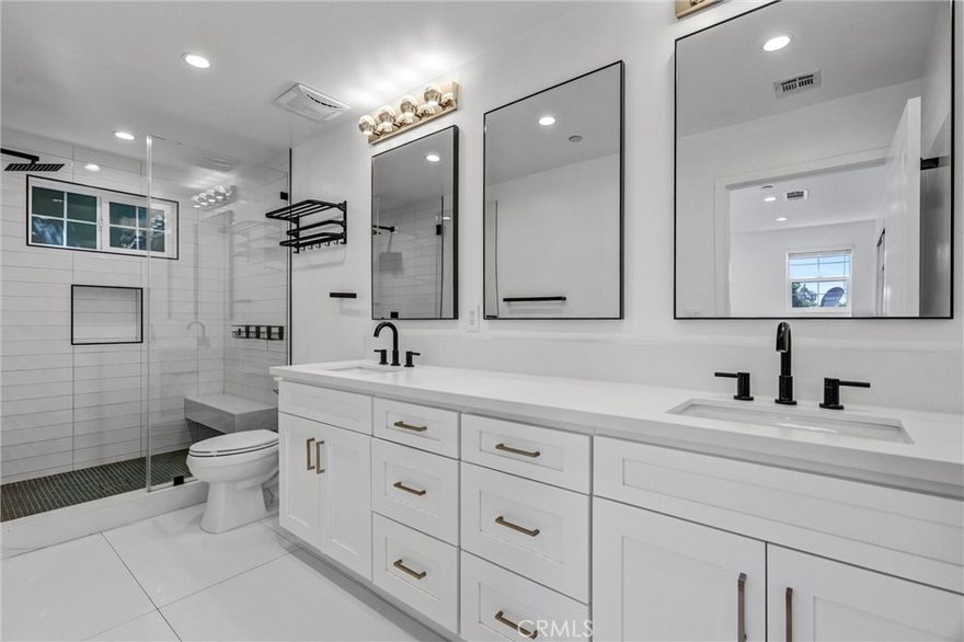 Welcome to this stunning new-construction Mediterranean home in the heart of Sherman Oaks. Built in 2023, the spacious open-concept main level offers a formal dining room with a charming balcony, a bright and inviting living room, a convenient half bath, and a chef’s kitchen featuring stainless steel appliances and a breakfast bar. Upstairs, you’ll find three generously sized bedrooms, two full bathrooms, and a dedicated laundry area with brand new LG washer and dryer. The luxurious primary suite is a true retreat, showcasing a spa-inspired bathroom with a double vanity and rainfall shower. The backyard is designed for entertaining, featuring a low-maintenance artificial turf yard and a fully equipped outdoor kitchen. Additional highlights include a main-level bedroom with its own ensuite bath and walk-in closet, a two-car garage, and a gated shared driveway. Ideally located just moments from Ventura Boulevard’s dining, shopping, and top-rated schools, this home offers the perfect blend of style, comfort, and convenience.