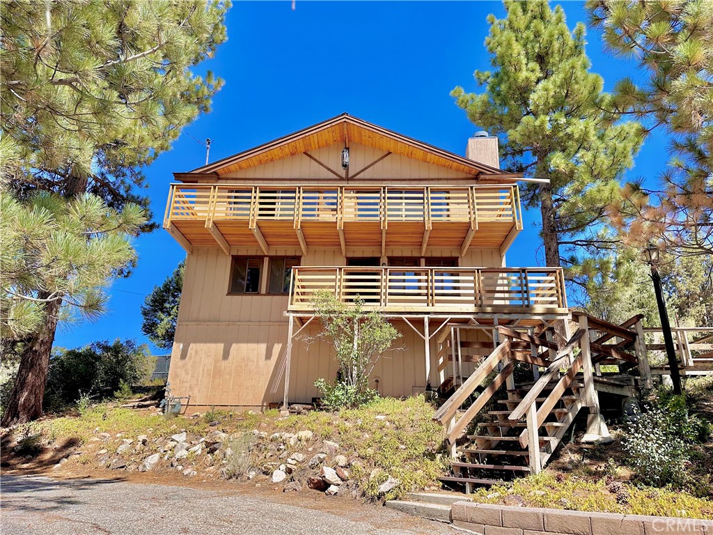 There are cabins, and then there are legacy homes.. The kind that carry within their walls the laughter, love, and memories of generations. This 3-Bed / 2-Bath, 1,408 sq. ft. cabin in the highly desirable Whispering Forest neighborhood of Big Bear Lake is just that. Built by the hands of the family’s grandfather, it has stood for decades as a cherished retreat and is now ready to welcome its next chapter.
Perched among towering pines with full-sized decks on both levels, this home offers an unrivaled connection to nature. From the upper deck, breathtaking mountain and forest views stretch endlessly as a daily reminder of the serenity and wonder that make Big Bear such a coveted escape.
Inside, the cabin’s vaulted ceilings and great room flooded with natural light create a sense of vastness and warmth. Every beam, plank, and window tells a story, blending timeless character with the opportunity for new owners to make it their own. With a bathroom conveniently placed on each level, it’s as functional as it is charming.
While lovingly maintained, the home invites thoughtful updates, giving buyers the chance to honor its history while enhancing its future. Whether envisioned as a short-term rental with strong income potential or as a personal mountain sanctuary, the possibilities are endless.
Located in the picturesque and highly sought-after Whispering Forest community, this cabin enjoys the best of both worlds.. Peaceful seclusion backed by the National Forest, yet just minutes from Big Bear Lake, ski slopes, hiking, the Convention Center, and year-round activities.
This is more than a property. It’s an opportunity to write the next chapter in a home that has already stood as the backdrop for countless family stories. For those seeking not just a cabin, but a legacy, this is a chance to carry forward a tradition of mountain living for generations to come.