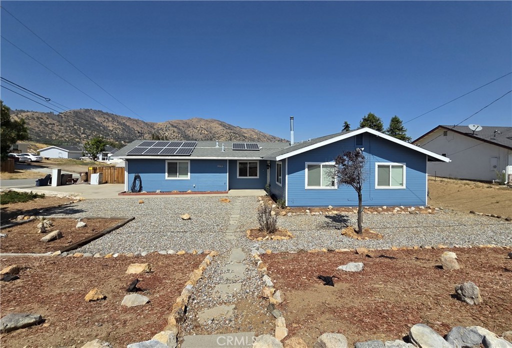 This adorable house has breathtaking views from every window! It's sitting on a huge corner lot in the West Golden Hills neighborhood with owned solar, 3 bedrooms, 2 bathrooms, separate family room, large covered patio, security screen front door, newer heating and air conditioning, newer windows, newer roof, newer appliances, wood burning stove and an attached 2 car garage. The exterior has been freshly painted and the interior has been cleaned with professionally cleaned carpets! There is nothing you need to do to this home but make it YOURS and then sit out back and enjoy the expansive views, while eating juicy pears or Granny Smith apples from your own trees! YUM!