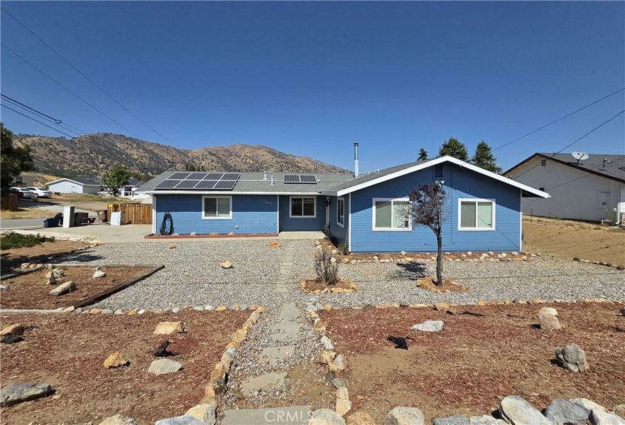This adorable house has breathtaking views from every window! It's sitting on a huge corner lot in the West Golden Hills neighborhood with owned solar, 3 bedrooms, 2 bathrooms, separate family room, large covered patio, security screen front door, newer heating and air conditioning, newer windows, newer roof, newer appliances, wood burning stove and an attached 2 car garage. The exterior has been freshly painted and the interior has been cleaned with professionally cleaned carpets! There is nothing you need to do to this home but make it YOURS and then sit out back and enjoy the expansive views, while eating juicy pears or Granny Smith apples from your own trees! YUM!