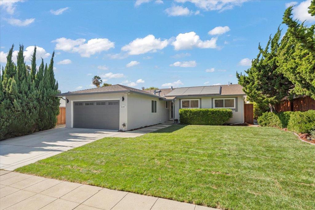 Beautifully updated, this three-bedroom, two-bath home blends modern upgrades with timeless charm. Bright, spacious living room and adjoining dining/game room with skylights create an open, inviting atmosphere. The chefs kitchen showcases quartz counters, laminate floors, and a generous dining nook. Additional highlights include fresh paint, hardwood flooring, recessed lighting, dual-pane windows, and Tesla solar panels for energy efficiency. The primary suite features a newly remodeled bathroom. Closet organizers in all closets. The finished garage offers an epoxy floor and bonus storage. Garage Ceiling and outside wall was insulated. Recessed lighting added to garage ceiling. Garage was used as an office during COVID. Private backyard with lovely foothill views, complete with an expansive paver patio, new lawn, fruit trees, is perfect for relaxing or entertaining. Ideally located minutes from top-rated schools like John Sinnott Elementary, BART, parks, shopping, and major freeways.