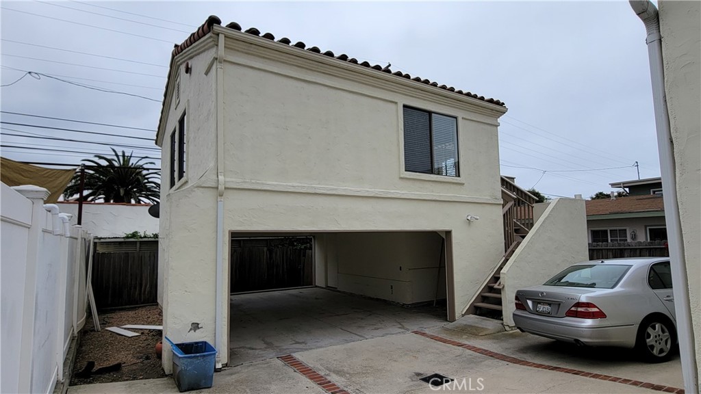 Not just a room, this is a stand-alone house! Close to downtown shops and restaurants. Peek ocean view. Quiet neighborhood. Stand alone one bedroom house with two-car carport below. Vinyl flooring throughout, freshly painted, SS refrigerator and shared washer & dryer and water, trash pickup and electricity included. Clean!!