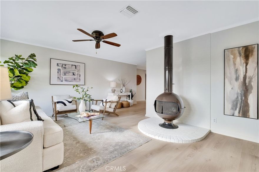 Sometimes the best things come in simple packages – this Redondo Beach one level home is just that.  Being offered for the first time in over 50 years, it has everything you need in a nice, neat bundle.  Let’s cover the highlights – 4 bedroom, one level layout; open kitchen with stainless appliances; the coolest freestanding fireplace to warm the living room; a front yard full of beautiful roses and a large grass area; plenty of off-street parking including a covered carport; a large backyard with a covered patio, shed and huge garden area (we’re talking enough space to supply veggies for the whole neighborhood); and an oversized garage for the creative type that likes to wrench on the hotrod or build whatever the mind can imagine.  There are new floors throughout the entire house and the inside just received a fresh coat of paint.  The functional floor plan provides 3 bedrooms together and a 4th bedroom that could be expanded to make an en-suite primary or be used as-is as a guest room or home office.  In terms of location, you really can’t ask for more.  Washington Elementary and Adams Middle School are conveniently located just down the street and there are several neighborhood parks equally as close.  Shopping and restaurants are near enough to ditch the car and travel by foot or bike, and commuting routes are easily accessible if you need to jump on the freeway for work or want to enjoy the endless entertainment opportunities in Southern California.  This all sounds great, but you really need to see this one in person before it’s gone!