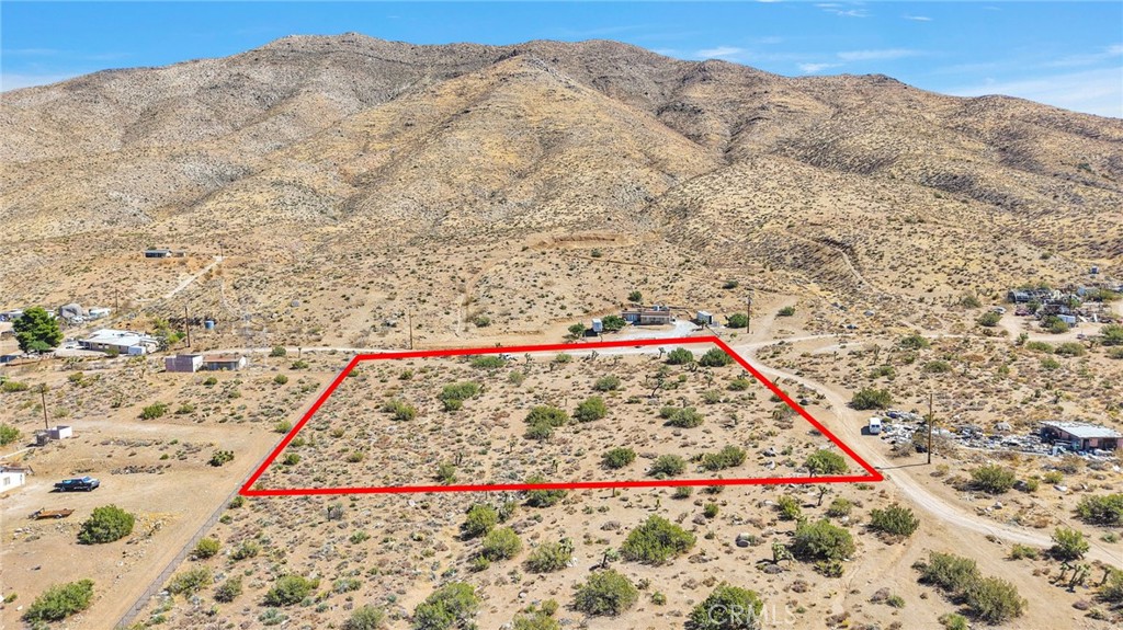 Just over 2 acres is this amazing CORNER LOT waiting for you to build your own home! In the county area of Apple Valley- which allows for livestock, equine, homesteading, etc. You could even add an ADU here. Appreciate the rural feel of desert living while being a short distance to major shopping and dining as well as the freeway, Silverwood Lake and mountain communities. Power poles run along Canaille Rd for close connection. Leave from horse back, or your desert toys to appreciate all that the desert has to offer