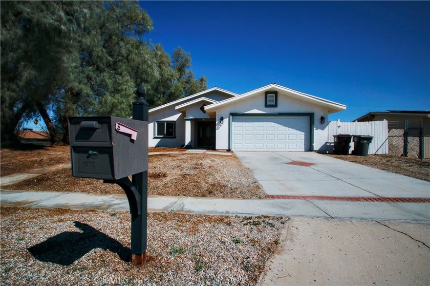 This large 4-bedroom, 3.5-bath home is full of potential with over 2,400 sq ft of comfortable living space in the heart of 29 Palms. Built in 2008, this home features a large open-concept great room, perfect for entertaining, and a modern open kitchen ideal for family gatherings or quiet nights at home. Enjoy the two primary bedrooms, each with its own private ensuite bath—ideal for multi-generational living or guest accommodations. The spacious interior includes a large indoor laundry room, natural gas heating, central A/C, and an energy-efficient tankless water heater. Additional features include an attached garage for secure parking and storage, and a generously sized layout that offers both space and functionality. Conveniently located near schools, shopping, and just a short drive to the 29 Palms Marine Base and Joshua Tree National Park, this home is perfect for military families, outdoor enthusiasts, or anyone seeking room to spread out in a great location. Don’t miss this rare find in 29 Palms – space, comfort, and convenience all in one!