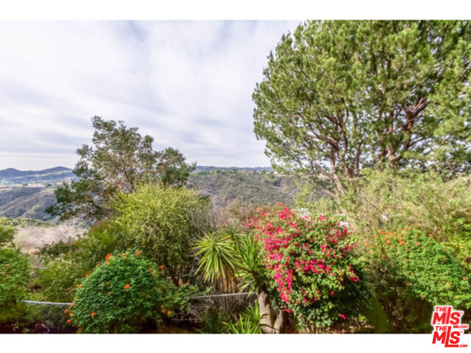 A lovely and upscale 2-bedroom and 2-bathroom condo unit is nestled in the prestigious Bel-Air neighborhood. Bright and beautiful, West facing canyon views! Thoroughly upgraded and remodeled stunning condo on first level. Gorgeous hardwood flooring, fire place, quartz kitchen with a new fridge and all appliances. Two expansive decks/balconies. Huge walk in closets plus storage spaces, wet bar, built in custom book cases and leaded glass french doors. Quiet building with heated pool, rec room, well outfitted gym and sauna. Assigned underground parking for 2 cars with additional garage storage unit. Located at the top of Bel Air, just a short walk to Roscomare Road elementary school, minutes from Sherman Oaks or Westwood Village.