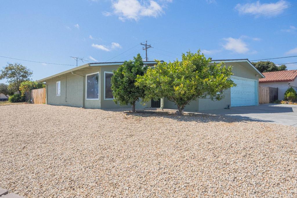 Welcome to this 4-bed, 2-bath, 1900-square-foot home! Your eyes will be drawn to the beautiful wooden ceilings. This home features newer kitchen appliances, a newer roof installed in October 2024, plus a freshly painted interior. The bathrooms have new vanities, flooring, and toilets. The kitchen cabinets have also been painted, and the driveway has been extended to provide additional parking for your larger vehicles! It even comes with some newer fencing. There is a sweet little side patio perfect for relaxing in the evening. Plus, there are 2 permitted side bonus rooms, which makes this space perfect for entertaining, turning into a game room or use your imagination to enjoy! There's even a utility sink in the garage! You don't want to miss this great home!