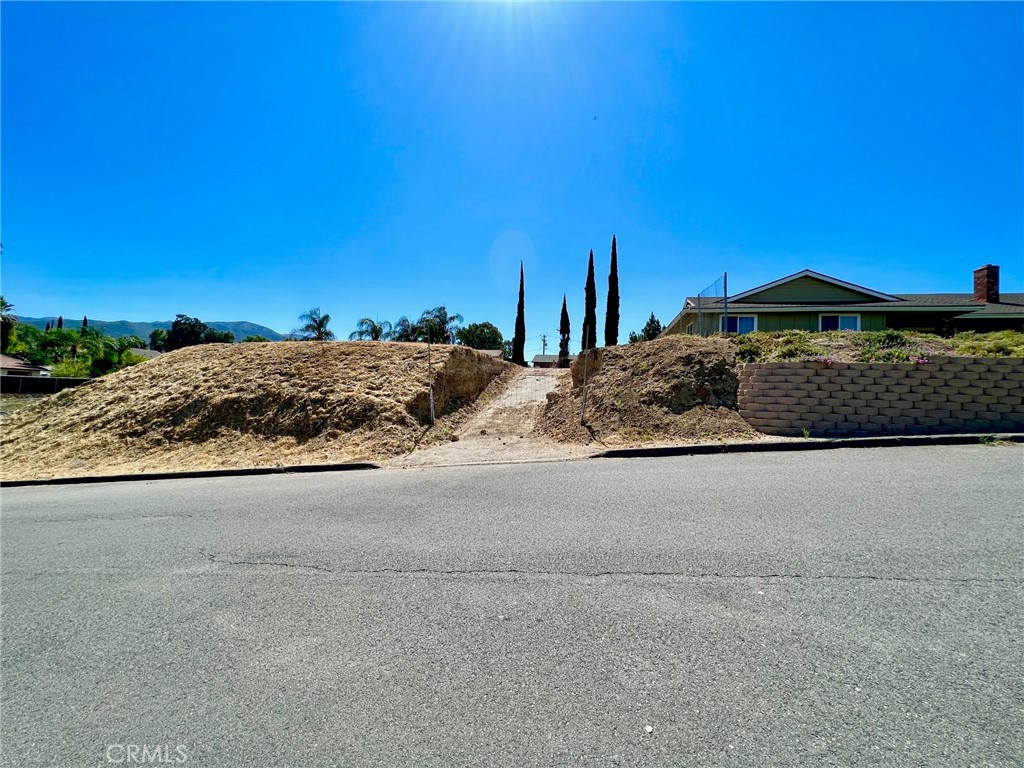Great Vacant Land! This is a flat lot with a Generous size, ready to build your Dream Home. It is located in an excellent residential area in Corona, centrally situated near Fwys 15 and 91 and shopping centers. The size of the property can facilitate the addition of an accessory dwelling (ADU) unit. The Lot Zoning is RA. A land survey has just been done so that the new owner will have records of the exact limits on this land.