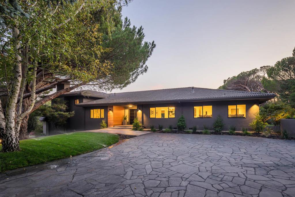 Situated near the end of a private cul-de-sac and amongst similar large estates is a remodeled contemporary home with 6BR's 6.5BA's plus a separate detached 3BR 2.5BA guest house. The home offers a superior layout, perfect for large or multi-generational families with its separate bedroom wings and generous proportions. This sleek home has custom cabinets, top of the line appliances and a great kitchen/family room combo that opens to a large outdoor patio equipped with a built-in BBQ, firepit, putting green, bocce ball, vegetable garden, expansive turf lawn and the start of a gentleman's vineyard. The 2nd family room or "game" room is adjacent to the theatre and a indoor covered pool with solar for year round enjoyment. The home also includes a 4 car garage, plus extra parking and a large wine cellar and ample storage throughout. A separate spacious 3BR guest house, complete with its own patio, lawn area, expands over two levels with high ceilings and great natural light.
