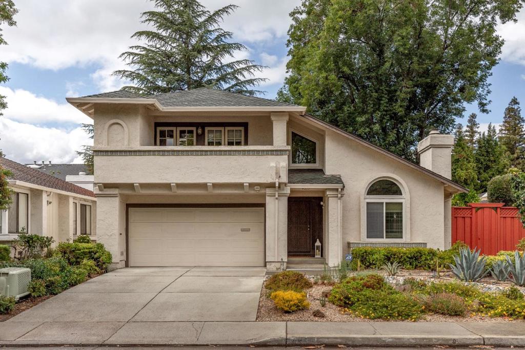 Welcome to this beautifully maintained 3 bed, 2 ½ bath home offering 2,086 square feet of functional living space. As you arrive, youll notice the thoughtfully designed drought-tolerant front landscaping both eco-friendly and low maintenance, adding great curb appeal. As you enter, you're greeted by vaulted ceilings and an abundance of natural light that creates a warm, open ambiance. The spacious living room features vaulted ceilings and a cozy fireplaceperfect for relaxing evenings. Beautiful laminate flooring flows throughout the main living areas, adding modern charm. A formal dining room offers a dedicated space for hosting meals and special occasions, while the open-concept kitchen connects seamlessly to the family roomideal for everyday living and entertaining. Upstairs, the primary suite impresses with vaulted ceilings and a walk-in closet. Two additional bedrooms share access to a balcony. Highly regarded Cupertino Schools! Located just minutes from the Apple and Nvidia Campuses, Mitsuwa Market, San Jose International Airport, Santana Row, and Valley Fair Mall, with easy access to Highways 280 and 880/17, this home combines comfort, style, and unbeatable convenience.