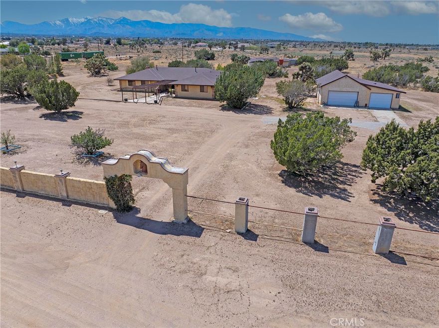 BACK ON THE MARKET Due to Buyer's Failure to Perform. Don't miss this great opportunity to own a beautiful 9.80 acre, (per survey) horse ranch and enjoy the Serene Lifestyle of the High Desert in the city of Oak Hills. This ranch has a 3157 sq. ft. 3 BR, 3 BA custom built home and includes five horse stables, a hay barn, a horse arena and a tack room for storing saddles, bridles and much more. The house features a very spacious main bedroom and the main bathroom has a sunken tub, dual sink vanity, separate shower and a bonus room next to the bedroom with a Jacuzzi spa and a free standing wood burning fireplace. The two spacious guest bedrooms have mirrored closet doors and extra storage underneath the windows. There are plenty of storage closets and cabinets throughout the house. There is a ceiling fan in almost every room of the house. The kitchen has new stainless steel appliances including a 5 burner stove with convection, regular and air fryer oven, as well as a refrigerator, dishwasher, microwave and trash compactor. The house has Japanese Red Oak kitchen cabinets, including all the cabinets and window sills throughout the house. It also features a huge Game room with a 17 ft. long wet bar and pool table. The family room has a stone decorated masonry fireplace with a solid wood mantle and a blower. There is a direct propane connection in the back patio for your barbecue grill and several electric outlets. The house also has a 2 inch water line with an anti-siphon valve. It has an oversize 3 car garage with plenty of room for a workshop, new septic tank with 2 cleanouts, (1 in front & 1 in back of house), 28 solar panels, underground electricity, 2 A/C units, 2 water heaters, 12 year old roof on house and horse stables, 6 month old roof on garage, new paint inside house and outside wood trim, dual pane metal windows and much more. This house is perfect for Holiday entertaining and family gatherings. It is close to shopping and approximately 4 miles to the I-15 freeway. There are too many amenities to mention so this is a "Must See".