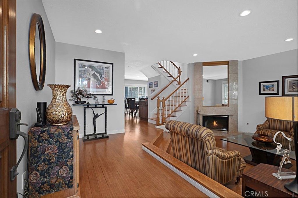 Unique to the city of Long Beach is "BIXBY VILLAGE." A Cape Cod New England styled community in a park-like setting. This end unit, extensively remodeled "BAYSHORE" townhome, is located in a great interior location & on the greenbelt! Formal entry, open living room with fireplace & access to the front patio. Separate dining room, gourmet kitchen with custom soft close drawers, extra storage, 6 burner Kitchen Aid gas cooktop, large hood with warming lights, extended counter for a cozy eating area & direct garage access. Separate inside laundry room. Private CENTER ATRIUM with waterfall spa. Skylight above the stairway provides natural light. Upper level primary BR with vaulted ceiling, l walk-in closet with custom cabinets, BA with double vanities & large steam shower. Spacious secondary en suite BR, vaulted ceiling, jetted tub & separate shower. Bamboo flooring & tiled BA's, recessed lighting, plantation shutters & granite counters...a must see! Close proximity to 2nd & PCH shopping center, restaurants, Alamitos Bay, CSULB, & California Distinguished Schools!