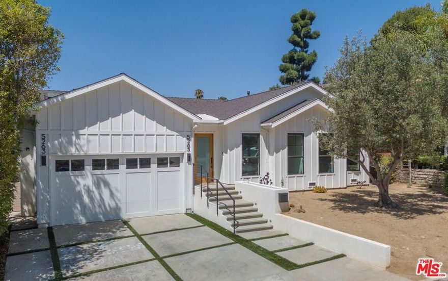 Located north of Colorado Blvd on one of Eagle Rock's most beautiful streets, this redesigned home with a pool and ADU balances indoor-outdoor living with thoughtful, modern upgrades. The entertaining spaces of the main home are anchored by a floor-to-ceiling slider that opens completely to a spacious deck and sweeping hillside views. The kitchen pairs a generous island with abundant cabinetry and premium appliances. The serene, sunlit primary suite offers a true retreat with dual sinks and a walk-in closet. Two additional bedrooms share a stylishly updated bath and connect via a center hall with concealed laundry and extra storage. Throughout, elevated finishes make daily living as functional as it is beautiful. The two-car garage has been transformed into a full wellness studio with weight rack, cardio, cold plunge, and infrared sauna included. Out back, a sparkling pool and spa set the stage for effortless entertaining and easy evenings under the stars. The standalone ADU at the rear of the lot features two additional bedrooms, 2 baths and a kitchen, perfect for visiting guests, a home office or chill pad. All of this is just moments from beloved local dining, coffee shops and neighborhood favorites, with seamless access to the best of NELA. Available partially furnished or unfurnished.