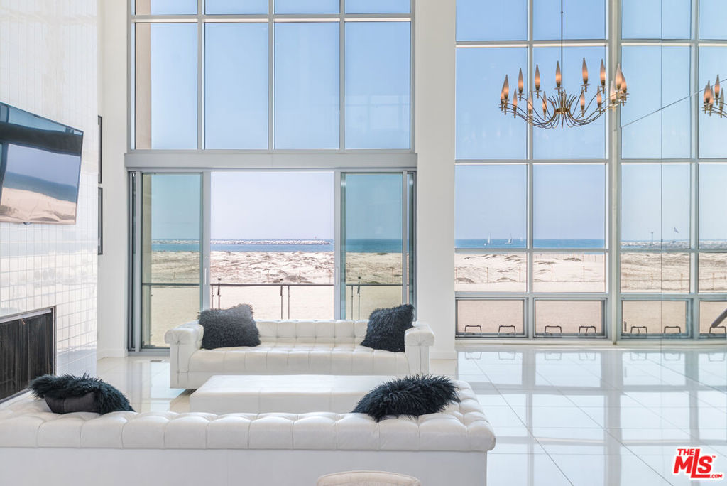 Welcome to an exceptional opportunity to lease a luxury beachfront residence in Marina Del Rey priced competitively and negotiable. This architectural masterpiece offers a unique living experience with stunning, unobstructed views of the Pacific Ocean and the Marina, allowing you to watch sailboats gracefully glide across the water from every room. Spanning three levels, the unit offers a thoughtful and spacious layout. You enter on the second floor, which features an open-concept living room, dining area, kitchen, and a powder room perfect for entertaining. Downstairs, you'll find two additional bedrooms, each with its own ensuite bathroom, along with a dedicated laundry room for added convenience. The third level includes another ensuite bedroom with direct access to a large private patio of approximately 350 sq. ft., ideal for relaxing or enjoying ocean breezes. Floor-to-ceiling windows flood the space with natural light, enhancing the sleek, modern design characterized by steel and glass elements. The open floor plan seamlessly connects the kitchen, dining, and living areas, creating a functional yet elegant environment. The state-of-the-art kitchen is equipped with high-end appliances, making cooking and hosting a pleasure. Whether you're lounging in the living room, preparing a meal, or waking up in the morning, the breathtaking views of the ocean and Marina are always in sight. Imagine watching the waves roll in or the sun setting over the water all from the comfort of your home. Located in the heart of Marina Del Rey, this coastal community is renowned for its scenic beaches, world-class marina, and endless outdoor recreation options. It's a dream for those who love waterfront living. Additional features include three-car parking (the unit is typically leased with one, but two extra spaces are included in the price) plus guest parking. All representing agents must accompany clients to all meetings and showings. Come home every day to beauty, comfort, and an unbeatable view!