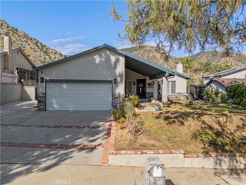 Welcome to this wonderful 4 bedroom, 2 bath home featuring PAID SOLAR and RV PARKING, located in a desirable Sylmar neighborhood with beautiful mountain views. This home offers plenty of space, including a cozy living room with a gas fireplace and a large separate family room, perfect for relaxing or hanging out. The open kitchen boasts stainless steel appliances, ample cabinet and counter space, and flows seamlessly into the dining area and family room. Enjoy energy savings with paid solar and comfort year-round with a NEW 5 ton A/C unit and a electric heat pump installed within the last couple months. The nice-sized backyard includes a storage shed and offers plenty of room for entertaining, gardening, or play. With charming curb appeal, scenic surroundings, and a commuter-friendly location just minutes from the 210 freeway and close to parks, this home combines comfort, convenience, and value.