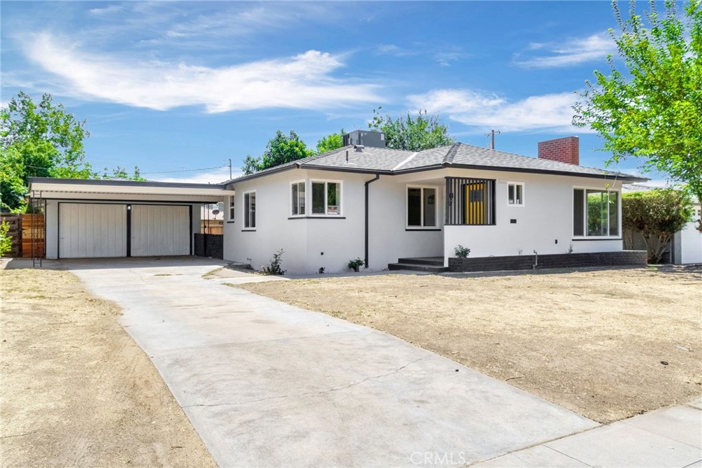 Make way for a charm with a pop of color! From the bold yellow front door to the stylish updates inside, this 3-bed, 2-bath, 1,442 sq. ft. home is full of personality and move-in ready. Fresh paint, updated flooring, and dual-pane windows fill the home with natural light, creating a bright and welcoming space. The kitchen is a showstopper with a beautiful backsplash, deep sink, sleek black accents, and newer appliances. Both bathrooms are tastefully updated with modern vanities, elegant mirrors, and stylish showers. The spacious primary suite offers its own upgraded bath with black-accent details and a chic fan for comfort. A roomy laundry area with storage, detached garage, and large backyard add practicality and potential to this already stunning home. Blending charm, comfort, and modern touches this one is a must-see!
