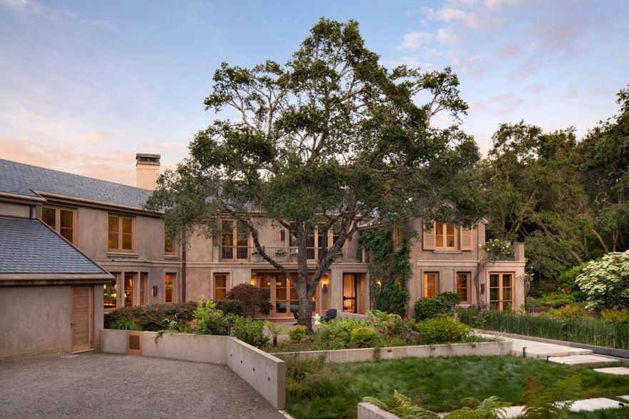 A rare offering on one of Central Woodsides most prestigious streets, just off Mountain Home Road, this extraordinary estate showcases architectural excellence, vineyard beauty, & a luminous natural setting. Spanning almost 4.4 acres with an optional adjacent 3-acre parcel also available, the grounds have been thoughtfully opened to invite abundant sunlight, enhancing both the ambiance and the usability of the land.  Designed by Ugo Sap and built by Van Acker Construction, the main residence is defined by dramatic scale, elegant curved forms, and exceptional materials. An elevator connects the two levels, which include six en suite bedrooms including a show stopping primary suite with terrace and spa bath beneath a retractable skylight. The library has walnut paneling and custom wood cabinetry with custom inset lighting. Outdoor living is equally impressive, featuring a thriving Pinot Noir vineyard, olive orchard, and multiple destinations for entertaining. A spacious poolside guest house includes a bedroom, full kitchen, sauna, and bath, while a separate structure with bath and kitchenette is ideal for a fitness center or executive office.  Plus a building  which has temperature controlled wine storage.  A truly world-class property with access to acclaimed Woodside School.