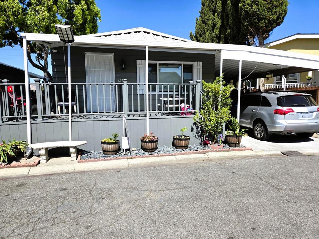 Explore this 1978 home located in the vibrant community of Silicon Valley. The home spans approximately 1,150 square feet and includes 2 bedrooms and 2 bathrooms. Inside, the living room and dining area feature elegant tile flooring. The kitchen is well-equipped with a tile backsplash, granite countertops, tile flooring, a stainless steel refrigerator, stove, oven, and an upgraded single-lever faucet. The master bedroom has laminate flooring and a triple-door closet, while the guest bedroom also offers laminate flooring and a dual-door closet. The master bathroom includes a tub and shower. Guest bathroom features a shower with a sliding glass door. Additional highlights of this home include a fully fenced backyard adorned with fruit trees, a utility room with tile flooring, and the inclusion of a washer and dryer. Central air conditioning and heating ensure comfort, and an extra bonus room adds versatility. The home has new fresh interior and exterior paint throughout, making it a turnkey property that is a must-see! Motivated Seller!!