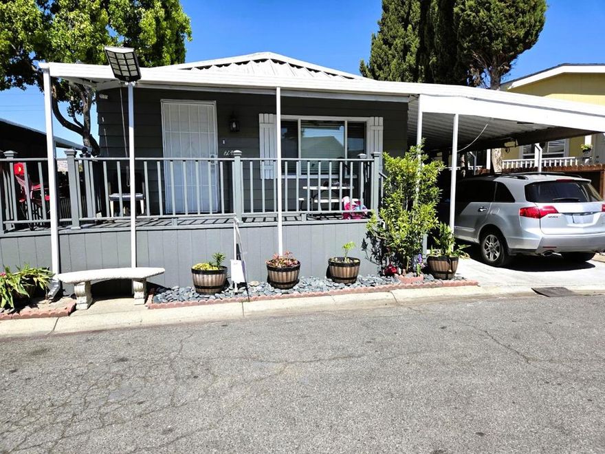 Explore this 1978 home located in the vibrant community of Silicon Valley. The home spans approximately 1,150 square feet and includes 2 bedrooms and 2 bathrooms. Inside, the living room and dining area feature elegant tile flooring. The kitchen is well-equipped with a tile backsplash, granite countertops, tile flooring, a stainless steel refrigerator, stove, oven, and an upgraded single-lever faucet. The master bedroom has laminate flooring and a triple-door closet, while the guest bedroom also offers laminate flooring and a dual-door closet. The master bathroom includes a tub and shower. Guest bathroom features a shower with a sliding glass door. Additional highlights of this home include a fully fenced backyard adorned with fruit trees, a utility room with tile flooring, and the inclusion of a washer and dryer. Central air conditioning and heating ensure comfort, and an extra bonus room adds versatility. The home has new fresh interior and exterior paint throughout, making it a turnkey property that is a must-see! Motivated Seller!!