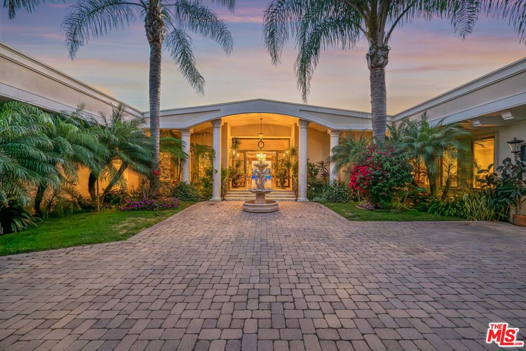 Experience luxury living in this recently renovated 5-bedroom, 5 bathroom gated Mid-Century Modern contemporary home, ideally located in prestigious Beverly Hills at Trousdale Estates. Featuring an open floor plan and soaring ceilings, the home offers breathtaking jetliner views from the city to the ocean with privacy and serenity. A formal entry leads to a spacious living room with multiple sitting areas, a sleek marble fireplace, and a stylish bar. The formal dining room and gourmet kitchen equipped with top-tier appliances and a large center island are perfect for entertaining. A bright breakfast area overlooks the pool and beautifully landscaped outdoor spaces. The home also includes expansive patios, a large entertainer's deck, an attached guest suite, and a separate lower-level 2-bedroom, 2-bath guest house ideal for guests, staff, or home office use. This one-of-a-kind lease opportunity is perfect for the most discerning tenants seeking elegance, privacy, and unmatched views.