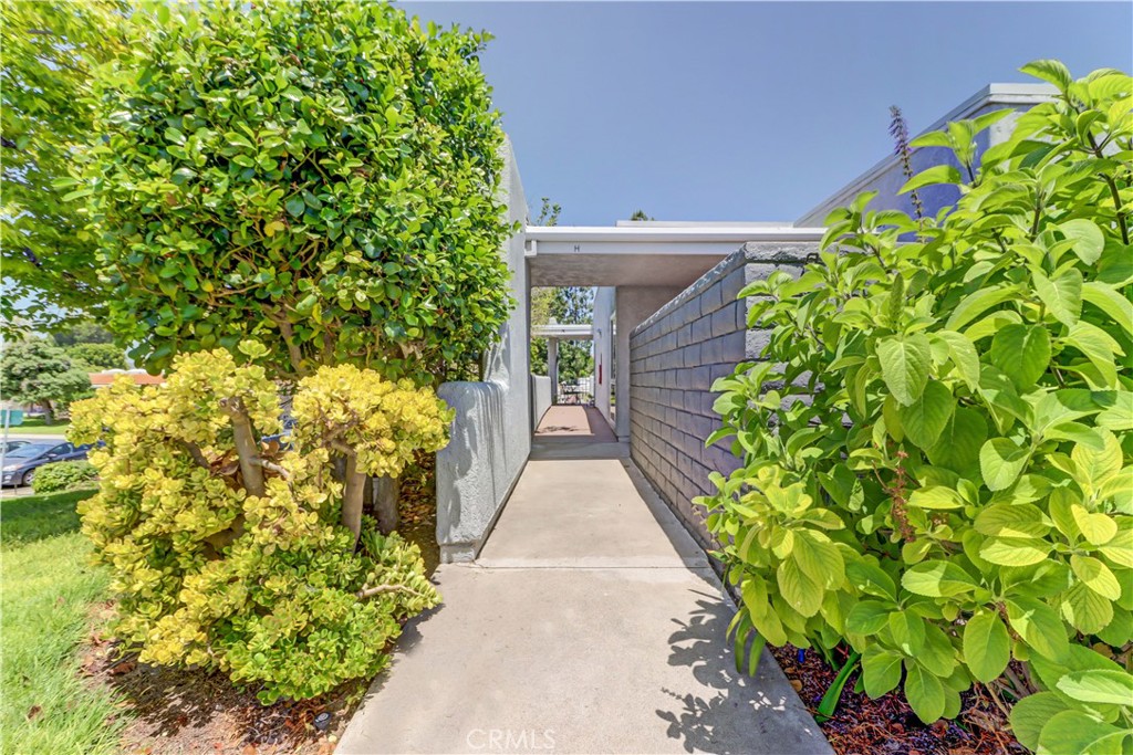 "Monterey" condo - this end unit model has an elevated, upstairs feel complete with a private balcony with no stairs to the entry. This is one of the most desired positions in the building! Balcony has peek-a-boo view of the mountains and receives a great breeze! Beautifully upgraded home featuring laminate flooring, crown molding, matching baseboards and smooth ceilings. Comfortable living room enjoys 2 large windows. Bright kitchen has large skylight, updated laminate countertops and large pantry storage closet. Bedrooms are on opposite ends of the home for nice privacy, guest room window faces west for afternoon sun and houses nice closet space. Spacious primary bedroom enjoys mirrored closet doors and carpeted for a soft touch. Bathroom offers tub/shower combo, large vanity and skylight. Convenient location between Gates 5/6 and close to Clubhouse 4 - the creative center of Laguna Woods with workrooms and classes in pottery, jewelry making, slip casting plus an awesome wood shop, painting studio with amazing lighting and huge sewing/quilting room. There is an Olympic size pool with hot tub and locker room. This condo provides an affordable option within Laguna Woods and there is non-warrantable condo FINANCING available. Laguna Woods Village residents enjoy a 27-hole championship golf course, a 9-hole executive par 3 course, pickleball and tennis courts, lawn bowling, gyms, clubhouses, swimming pools, horse stables, gardening centers, artist studios, computer workrooms and classes + over 200 clubs and organizations.