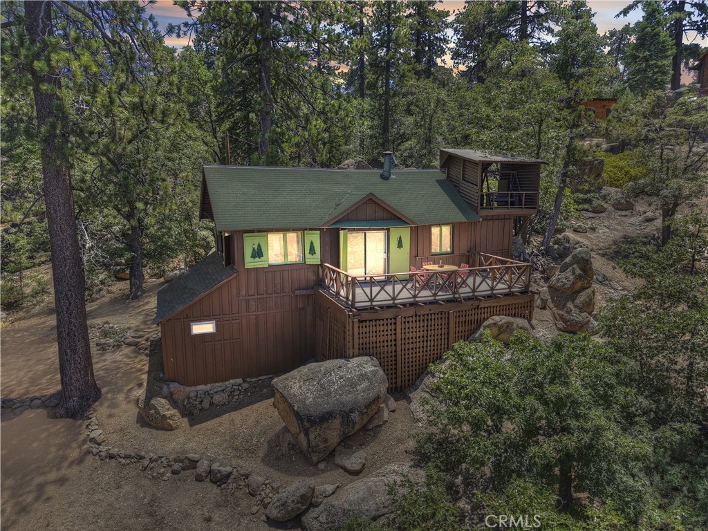 THE VIEW'S THE THING! Wait until you see the spectacular lakeview from this charming two-bedroom, one and a half bath Gov't cabin with vaulted trellis ceilings, woodsy interior with real wood burning fireplace, quaint country kitchen with antique wood stove (separate electric oven/range too), kitchen nook dining area, front entry mud room area with seating, central forced air heating, large "tuflex" deck plus a bonus "TOP" view deck and a small garage area for storage all sitting amongst the ancient granite outcroppings and all with a view to die for.