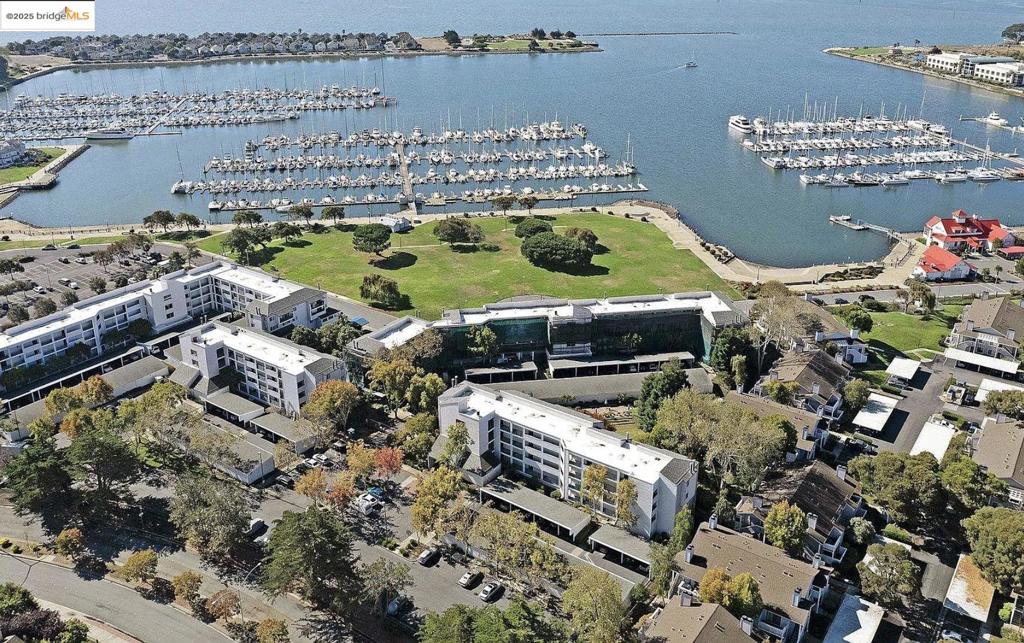 OWNER FINANCING AVAILABLE! Waterfront community living at its best — beautiful bay views, peaceful surroundings, and unbeatable convenience. This well-kept, gated community is just minutes to highways, restaurants, the Bay Trail and the Richmond Ferry. This unit offers two primary bedrooms each with their own bathrooms, in-suite laundry, bay-views, hardwood or laminate floors, and double-pane windows. At just over 1,000 square feet, this layout delivers the best of both worlds—easy to maintain yet spacious enough to live, work, and entertain in comfort. This unit offers two primary bedrooms each with their own bathrooms, in-suite laundry, oversized windows with bay views will have you soaked in natural light throughout the day. The open floor plan ensures every square foot is maximized, creating a home that feels much larger than the numbers suggest. Come stop by and see for yourself!