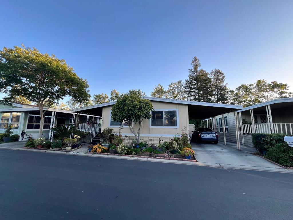 Great opportunity in highly coveted community! This home has a beautiful open floor plan with 2 bedrooms, 2 full bathrooms, 1,900 (approx) sq ft of living space, and a back yard area with mature fruit trees. This home offers laminated floor throughout the home, air conditioning, many windows for natural light to flow throughout the days, and a carport for easy parking. Conveniently nestled in a nice and quiet neighborhood with a community clubhouse, the home is also close to grocery stores, dining, shopping, and freeway access. Please note at least one occupying buyer must be 55 years or older to close escrow. All other residents must be 18 years or older, qualifying buyers are subject to park approval.