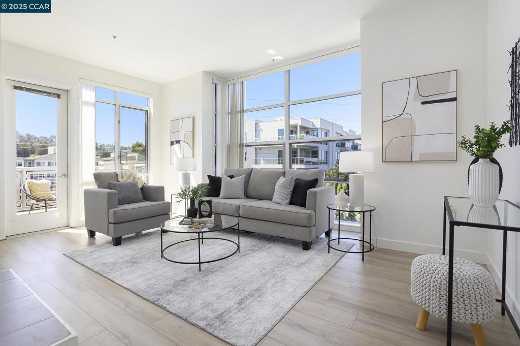 Welcome to City Living at Its Finest — Penthouse Unit at The Mercer Perched on the northwest corner, this stunning condominium is filled with natural light and enhanced by soaring ceilings and floor-to-ceiling windows in the living and dining rooms. As a rare top-floor unit, it offers a bright, open atmosphere that’s both elegant and inviting. It is beautiful! Freshly updated in July 2025, the home features new high-end luxury plank flooring (excluding bedrooms), fresh interior paint, designer lighting, updated bathroom fan/lights, and professionally refurbished grout—creating a “like new” feel throughout. At the heart of the home is a modern kitchen complete with stone countertops, stainless steel appliances, and a Sub-Zero refrigerator. The formal dining room adds an extra touch of sophistication for entertaining. The flexible floor plan includes a third bedroom that functions as a second primary suite with direct bathroom access—perfect for guests or multigenerational living. The two primary suites are thoughtfully separated for maximum privacy. Additional highlights include a full-size laundry room with cabinet storage, a dedicated storage space within the building, and bike storage. FIRST OPEN HOUSE, SUNDAY 8-3 FROM 1-4PM. Come by and be wowed.