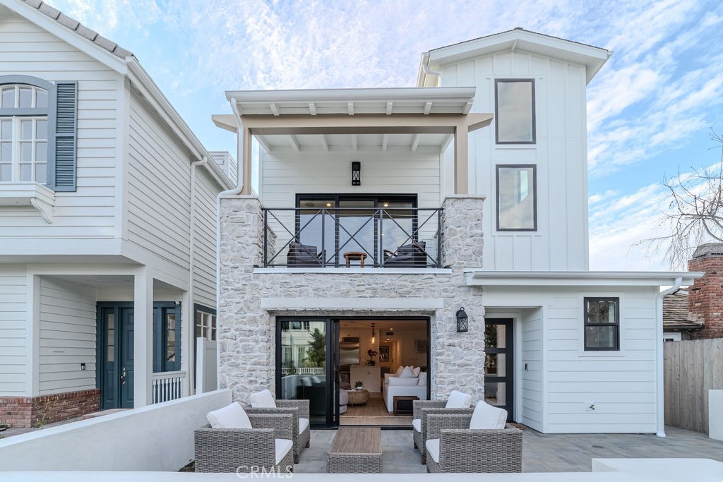 Brand new construction available for summer lease! Welcome to 603 Acacia—an impeccably designed, fully furnished front-unit lease located on the ocean side of Pacific Coast Highway in the heart of Corona del Mar’s coveted Flower Streets. Built by Thomas James Homes, this coastal residence offers 3 bedrooms, 4 bathrooms, all en suite, and luxury finishes throughout. The open-concept floorplan features a stunning floating staircase, wide-plank hardwood flooring, high ceilings, and abundant natural light. The main living area includes a cozy gas fireplace and flows seamlessly to the private front patio. The chef’s kitchen is outfitted with top-of-the-line Wolf appliances and a cozy dining nook. Main Level downstairs ensuite bedroom, powder room, and laundry room complete the first level. Upstairs, the elegant primary suite includes a private balcony, walk-in closet, and spa-inspired bath with dual sinks and walk-in shower. A third ensuite bedroom and secondary bath are also located on this level. Enjoy ocean breezes from the rooftop terrace and third-floor covered deck with built-in kitchenette and powder room. Just blocks to CDM beaches, restaurants, and shops, and approximately 7 miles from John Wayne Airport (SNA). Available fully furnished with short- or long-term lease options. Call for rates and availability.