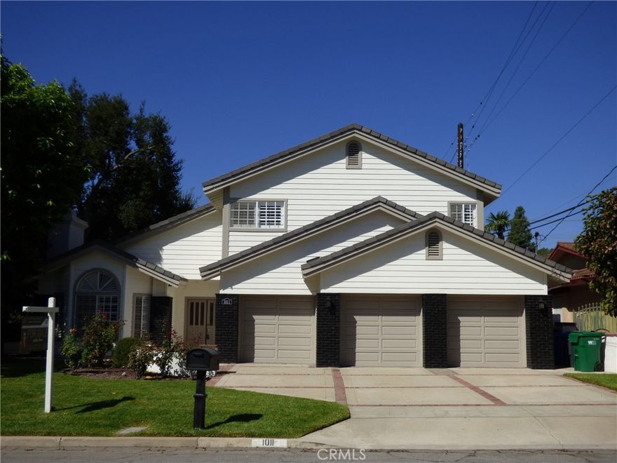 Located in the desirable Santa Anita Oaks neighborhood and within the award-winning Arcadia School District, this remodeled 5-bedroom, 4-bathroom home is perfect for large families. It features two master suites—one on each level—ideal for multi-generational living or guests. The first floor boasts tile and hardwood flooring, an open-concept kitchen, and a large family room with a fireplace and bar, perfect for entertaining. This home has been freshly repainted inside and out, giving it a crisp curb appeal. The newly painted exterior enhances the home's charm and durability. The family room has been renovated with a new fireplace, creating a warm and inviting space for gathering. The powder bathroom has also been upgraded with brand new appliances and a stylish new sink. Upstairs, the spacious master suite includes French doors that lead to a private patio overlooking the backyard, complete with a pool, jacuzzi, and built-in BBQ. Additional features include a 3-car attached garage. Move-in ready and thoughtfully refreshed, this home offers both charm and convenience!