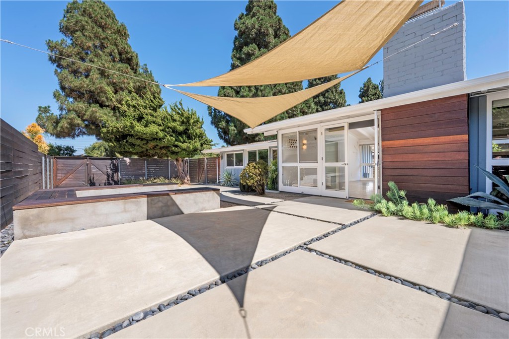 Now available for lease for a term of 12 months or greater, an exceptional Cliff May designed mid-century modern residence in the renowned Rancho Estates of Long Beach. This pristine property has been well maintained by the owners, and it features the qualities you expect from a classic 1950s design: indoor-outdoor living, abundant natural light, open beam ceilings, clerestory windows, etc. The home provides modern comforts as well, including central heat and air conditioning, a living room fireplace, a spacious island kitchen with breakfast bar, upgraded bathrooms, and interior laundry (in the garage with direct access from the house). The outdoor spaces are enclosed for private use and enjoyment and include a spacious patio with sail-shades for dining and lounging, a firepit with built-in seating, and thoughtfully curated drought-resistant landscaping. The property is sited on a quiet interior lot within the neighborhood, on a beautiful street lined with pines trees, a short walk to 800 acre El Dorado Park and Nature Center. The neighborhood also has access to a bike path along the San Gabriel River to the expansive sand beaches of Seal Beach (approximately 5.5 miles). There is a lot to love about this home and this community.