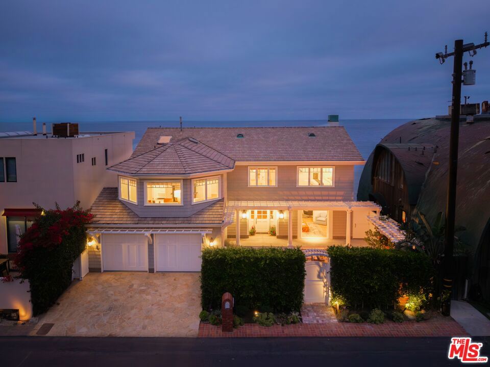 This picture-perfect, East Coast-style oceanfront estate in the prestigious guard-gated Malibu Cove Colony offers large, light-filled rooms and an impeccable floor plan designed for both comfort and elegance. A true turnkey residence, it blends timeless Cape Cod charm with the ease of Malibu beach living. Featuring 4 spacious bedrooms | 5 bathrooms, nearly every room captures panoramic Pacific Ocean views. Interiors are fully furnished with designer-selected pieces, curated artwork, and high-end finishes. Expansive glass doors create seamless indoor-outdoor living, opening to sun-drenched decks and direct beach access. Recently taken down to the studs and completely renovated by a renowned Los Angeles construction team, with interiors by celebrated design firm Brown Design, every detail has been elevated to the highest standard. Located within one of Malibu's most coveted 24/7 guard-gated enclaves, this rare offering combines privacy, security, and the ultimate in turnkey coastal luxury. Offered at $15,500,000