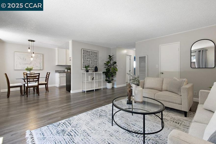 Welcome to this beautiful 2-bedroom, 1-bath lower-level unit featuring an open-concept layout designed for comfortable living and effortless entertaining. The dining area is perfectly situated under a centered chandelier, creating an inviting atmosphere for meals and gatherings. The kitchen boasts new appliances, ample counter space and crisp white cabinets, offering both style and functionality. 2 large bedrooms with large closets for all your storage needs.  Located close to shopping centers, great restaurants and a large community park. This home offers both tranquility and accessibility. The community amenities include a pool, courts and outdoor sitting areas. Don't miss the opportunity to live in this desirable Concord location!