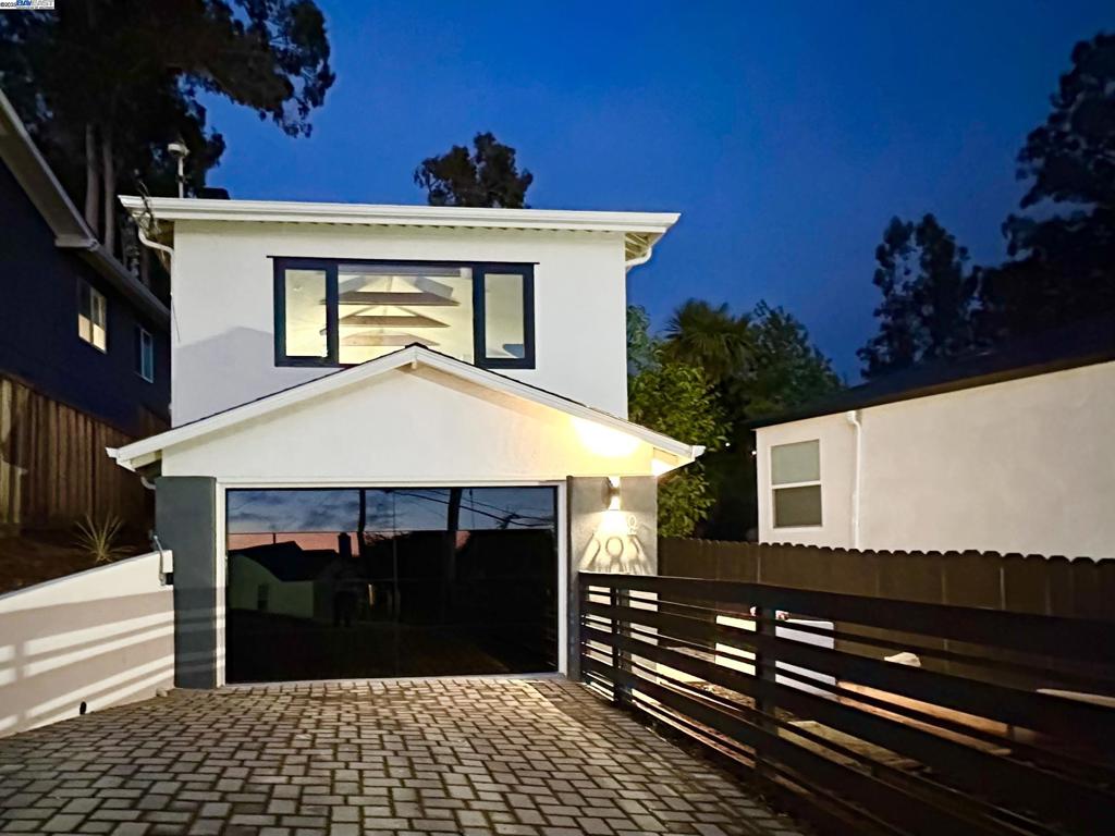 Experience elevated Bay Area living in this fully renovated three-bedroom, two-bathroom home tucked in the Oakland Hills. Thoughtfully redesigned, it blends modern elegance with breathtaking views of the San Francisco skyline, ocean, and unforgettable sunsets. The open floor plan highlights soaring vaulted ceilings, skylights, and expansive black aluminum windows that fill the space with natural light. The living room, dining area, and kitchen flow seamlessly together, all oriented to capture panoramic vistas. At the rear, bi-fold doors open to a private patio and backyard retreat, creating the ultimate indoor-outdoor lifestyle. The expansive lot offers a bird’s-eye view of the Bay Area, while the front yard planter boxes invite you to grow your own produce. Additional highlights include: • A sleek, modern clear-view glass garage door • Contemporary finishes throughout • Professionally landscaped lot with multiple outdoor living areas • Designer details that balance comfort and sophistication With its stylish updates, spectacular surroundings, and unmatched views, this home delivers the very best of Oakland hillside living.