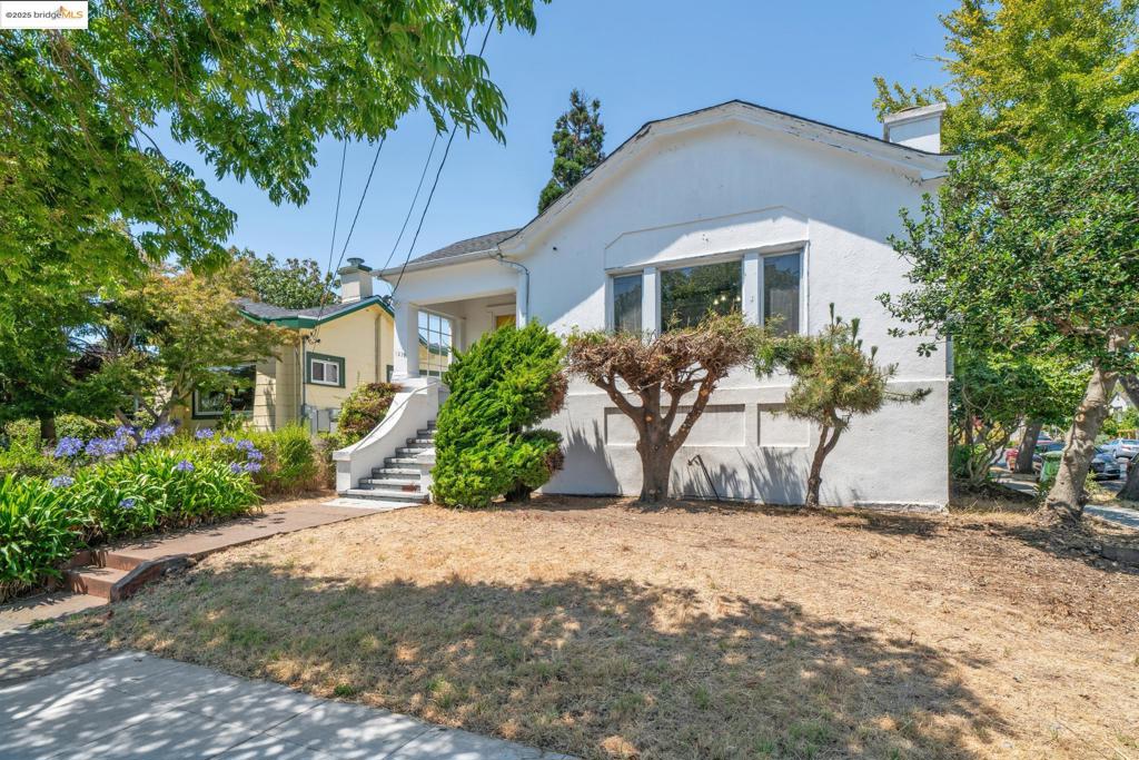 Nestled at the corner of Carleton and Mabel, this vintage craftsman home built in 1920 offers timeless charm and exceptional potential. From the moment you step inside, you are welcomed by rich wood-paneled walls and gleaming hardwood floors in the foyer and the living room. This generously sized living room has large wood-framed windows overlooking the street, and beautifully crafted built-in cabinets. The elegant French doors lead to the formal dining area with an antique cabinet. The retro kitchen has a cozy breakfast nook – perfect for casual meals and gatherings with family or friends. The home features three well-appointed bedrooms accessed via a central hallway, along with a full bathroom thoughtfully located for convenience. There is an interior access from the laundry room to the downstairs garage, which opens to Mabel Street. It provides ample room for storage, too. The backyard offers endless possibilities – create a private garden oasis, entertain guests under the open sky, or grow your own vegetables. The property is located in a vibrant neighborhood with a short stroll to San Pablo Park, shops and restaurants, and easy access to the highway. With classic character and room to personalize, this home is brimming with potential!