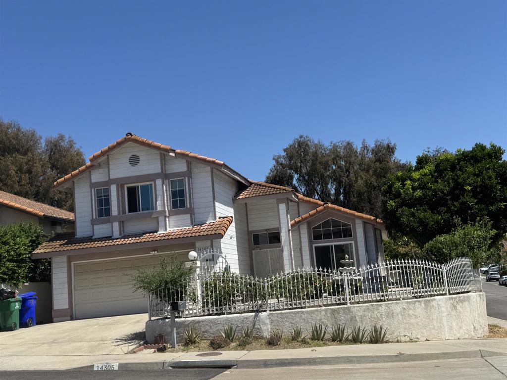 A must see! Don't miss the opportunity to own this property. County record indicates property has 4 bedrooms 3 bathrooms, but actually property has 5 bedrooms, one bedroom downstairs and 4 bedrooms upstairs,This house offers a hamonious and serene outdoor lifestyle, featuring view, high ceiling, covered patio, fruit trees, convenient location to school, freeways and stores. Come to make it yours.