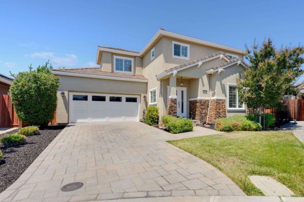 Discover 107 Jasmine Court, a beautifully crafted 4-bedroom masterpiece on a quiet cul-de-sac in one of the most sought-after neighborhoods in Campbell. Built in 2016, this spacious home features an open-concept layout with an expansive great room, elegantly coffered ceilings, crown molding, hardwood floors, plantation shutters, dual paned windows, LED recessed lighting, EV charging, and high-end finishes throughout. The gourmet kitchen is a chefs dream with quartz countertops, custom cabinetry, and premium stainless-steel appliances. Retreat to a luxurious primary suite with a spa-inspired dual sink bath, while guests can enjoy the convenience of a bedroom and full bath downstairs. Designed for California living, this corner lot boasts a spacious backyard, providing the perfect setting for entertaining, gardening, or admiring the sunset. Enjoy award winning schools, tree-lined streets, walking-distance to parks/playgrounds, and proximity to downtown Campbell, tech campuses, and shopping. This is refined Silicon Valley living at its best.